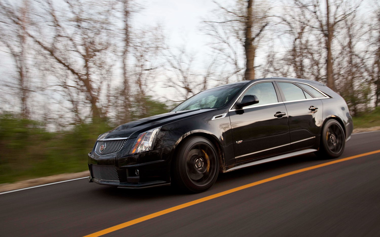 2011-cadillac-CTS-V-sport-wagon-front-three-quarters-in-motion-2.jpg