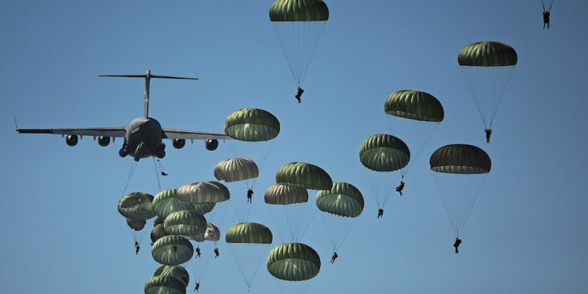 Defense.gov_News_Photo_110910-GO452-406_-_U.S._Army_paratroopers_from_the_82nd_Airborne_Division_descend_to_the_ground_after_jumping_out_of_a_C-17_Globemaster_III_aircraft_over_drop_zone-840x420.jpg